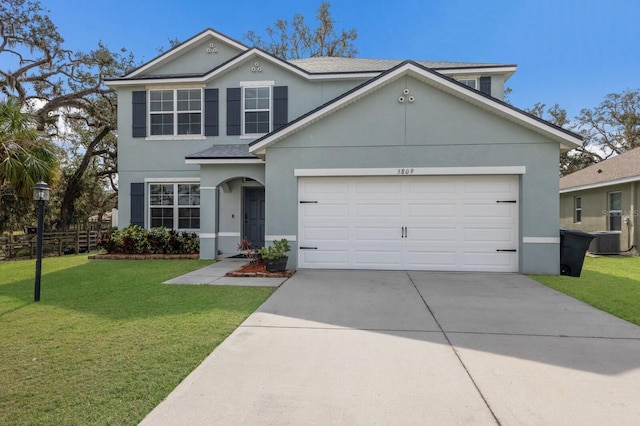 view of front of home featuring a garage and a front yard