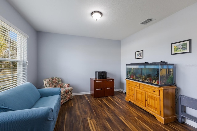 living area featuring dark hardwood / wood-style floors