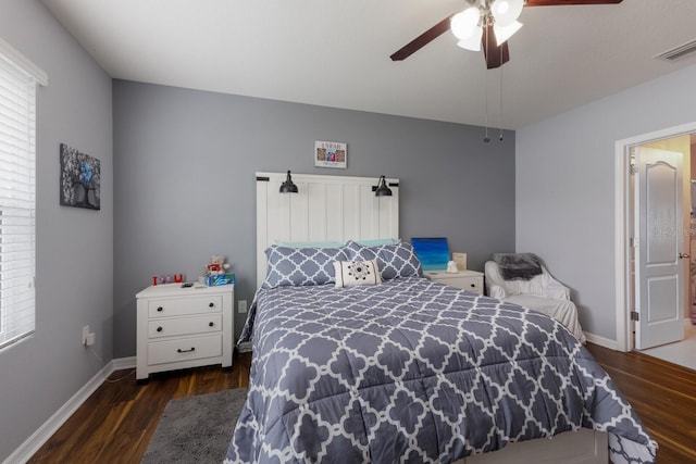 bedroom with multiple windows, ceiling fan, and dark hardwood / wood-style flooring