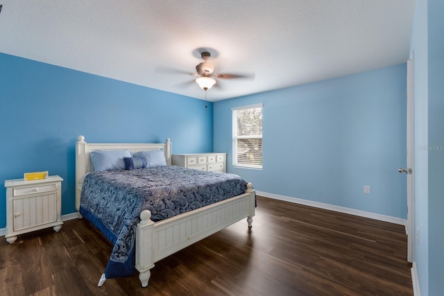 bedroom featuring dark hardwood / wood-style flooring and ceiling fan