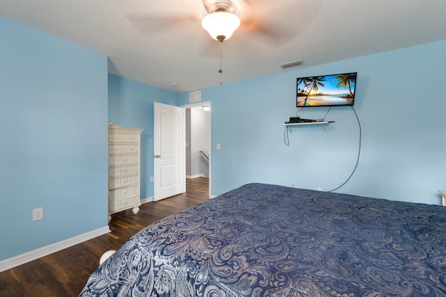 bedroom featuring dark wood-type flooring and ceiling fan