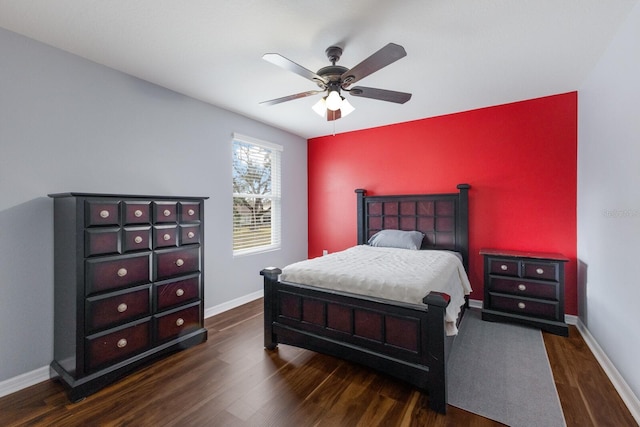 bedroom with dark wood-type flooring and ceiling fan