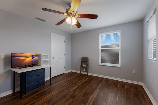 interior space with dark hardwood / wood-style flooring and ceiling fan