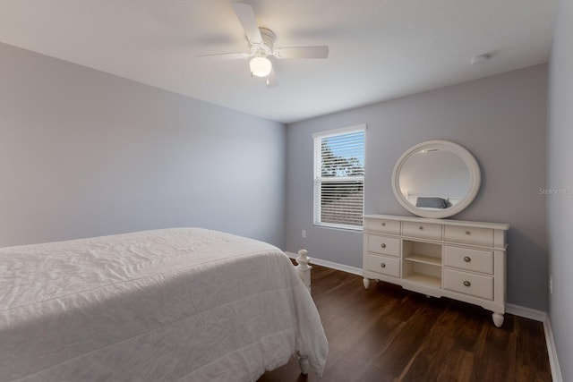 bedroom featuring ceiling fan and dark hardwood / wood-style flooring