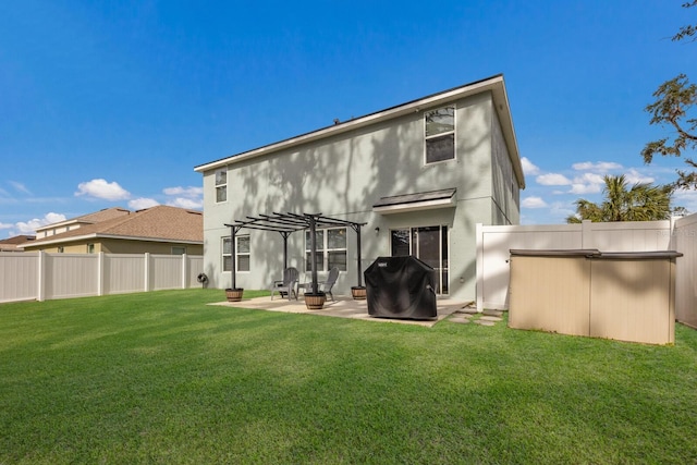 back of property featuring a patio, a fire pit, a yard, and a pergola