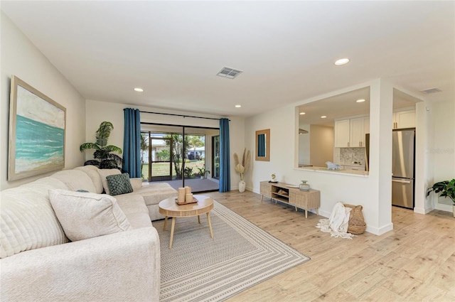 living room with light hardwood / wood-style floors