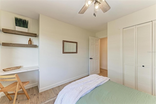 bedroom featuring light hardwood / wood-style floors, a closet, and ceiling fan