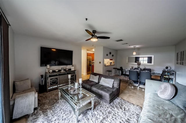 living room featuring ceiling fan