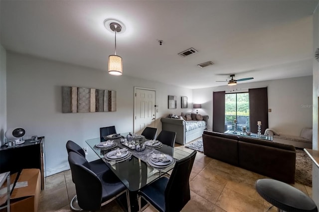 dining room featuring ceiling fan