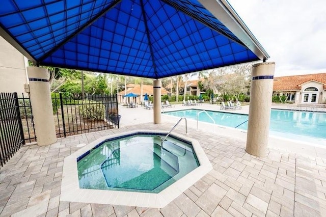 view of pool featuring a hot tub