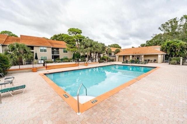 view of swimming pool featuring a patio