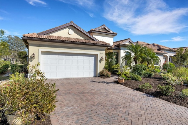 mediterranean / spanish house with a garage