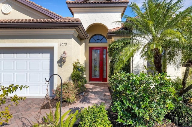 property entrance with a garage