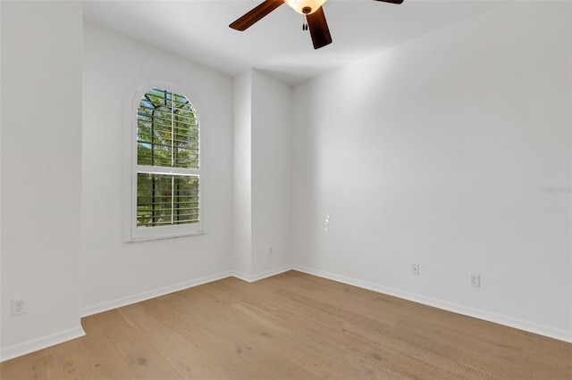 spare room featuring light hardwood / wood-style floors and ceiling fan