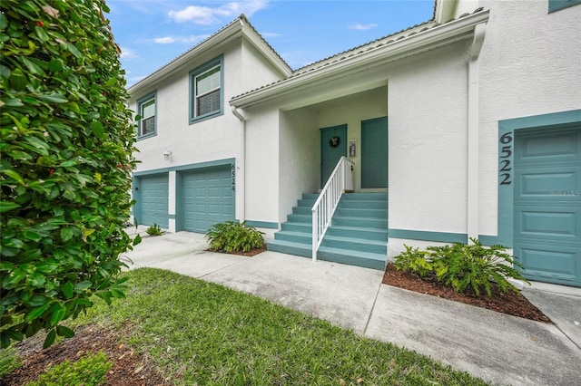 doorway to property featuring a garage