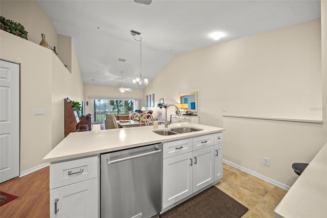 kitchen featuring sink, white cabinets, hanging light fixtures, stainless steel dishwasher, and a center island with sink