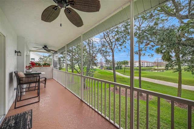 balcony with ceiling fan and a porch