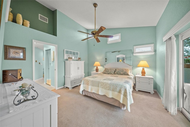 bedroom with lofted ceiling, light colored carpet, and ceiling fan