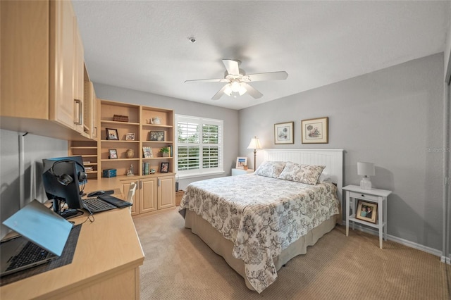 bedroom with ceiling fan and light colored carpet