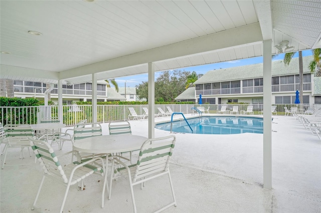 view of swimming pool with a patio area