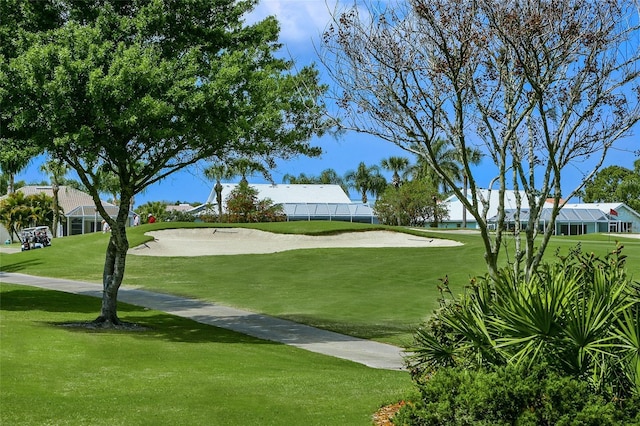 view of home's community with a lawn