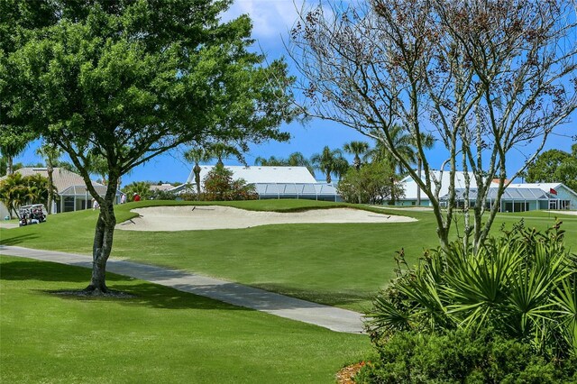 view of property's community featuring a lawn