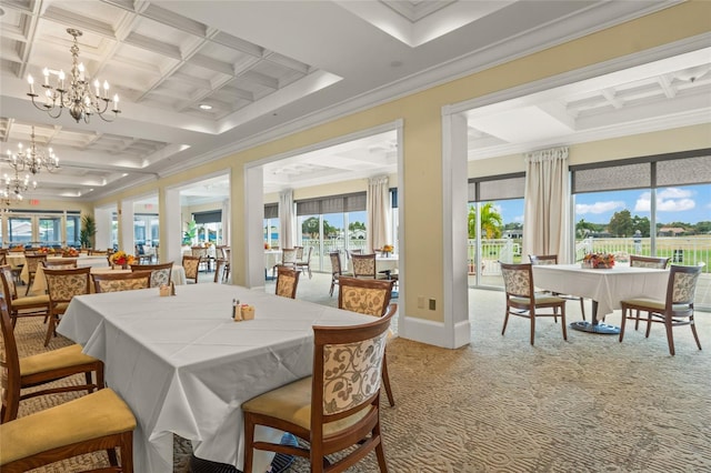 dining space with a notable chandelier, light carpet, coffered ceiling, baseboards, and crown molding