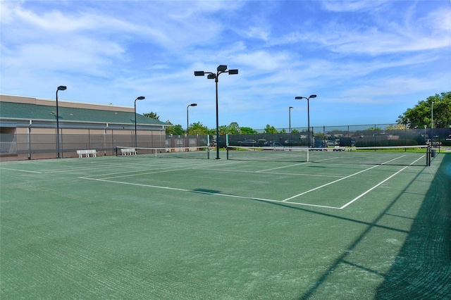 view of sport court with fence