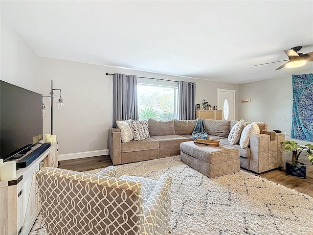 living room with hardwood / wood-style flooring and ceiling fan