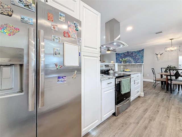 kitchen featuring stainless steel appliances, island exhaust hood, and white cabinets