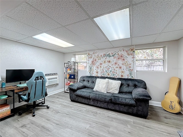 office space with hardwood / wood-style floors and a drop ceiling