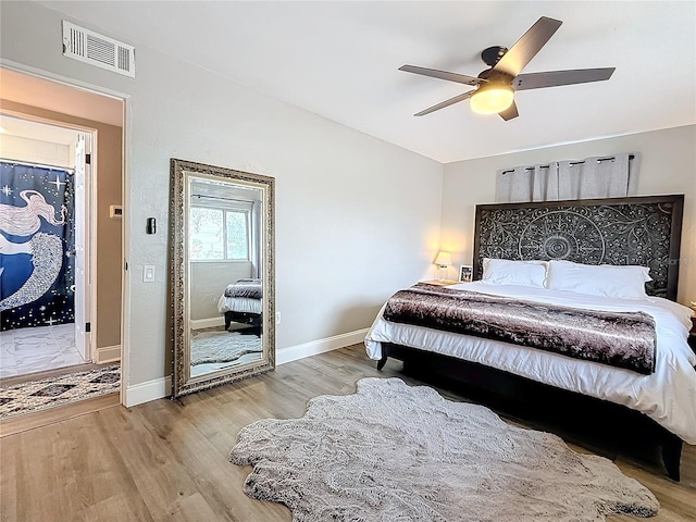 bedroom with ceiling fan and light hardwood / wood-style flooring