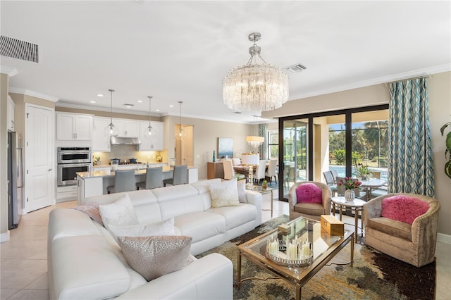 tiled living room featuring ornamental molding and a chandelier