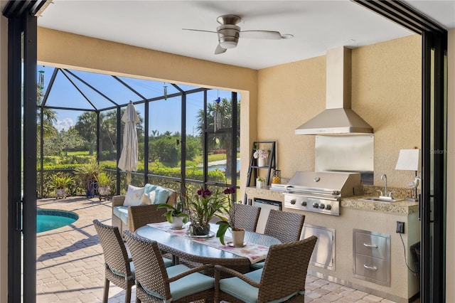 view of patio / terrace featuring area for grilling, sink, and a grill