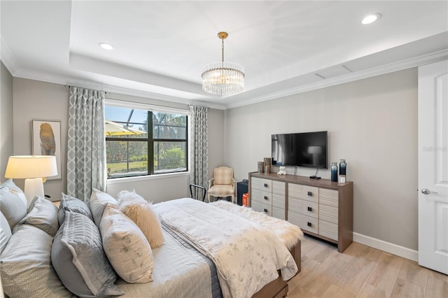 bedroom with a raised ceiling, crown molding, an inviting chandelier, and light wood-type flooring