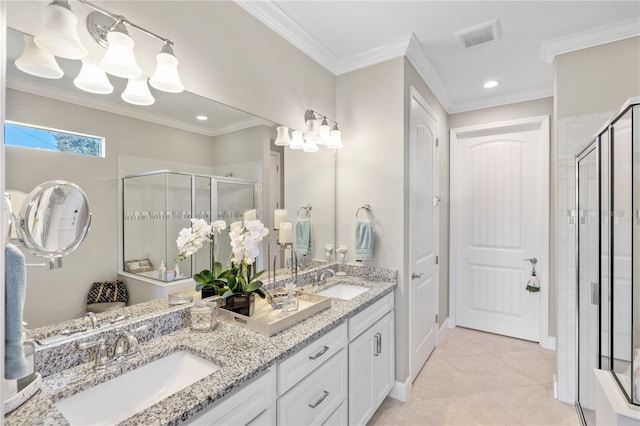 bathroom featuring walk in shower, ornamental molding, tile patterned flooring, and vanity