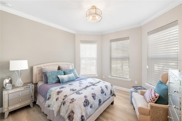 bedroom with ornamental molding and light wood-type flooring