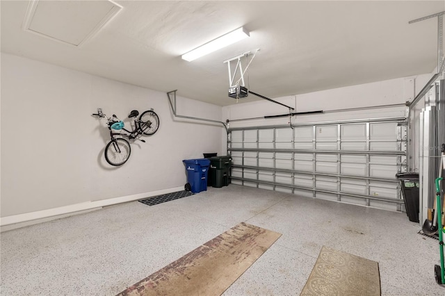 garage featuring a garage door opener