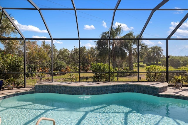 view of swimming pool featuring a lanai and pool water feature