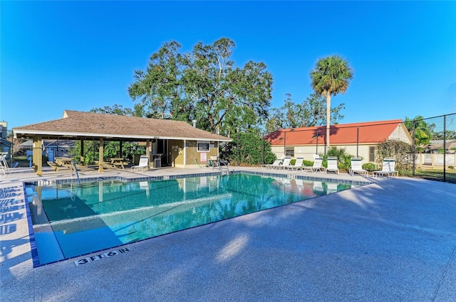 view of pool featuring a patio