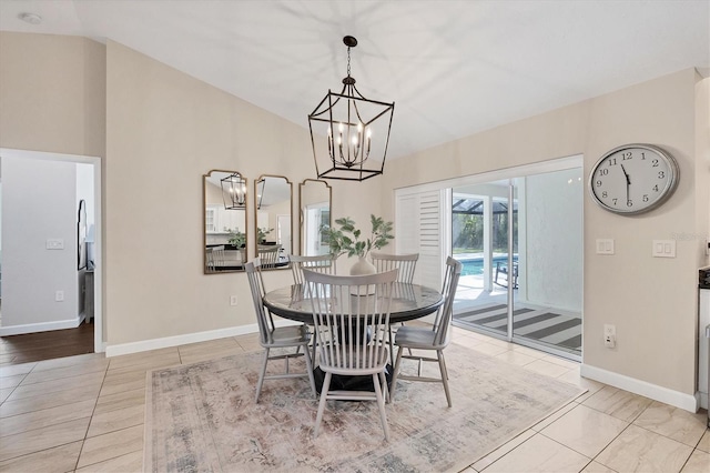 tiled dining room with vaulted ceiling and a chandelier