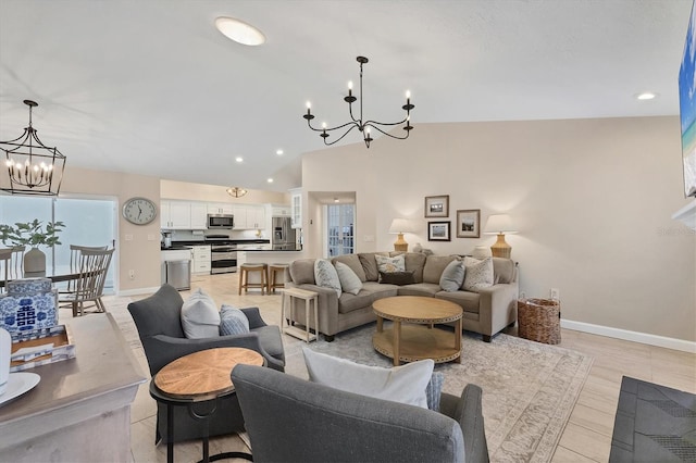 living room with a notable chandelier and vaulted ceiling