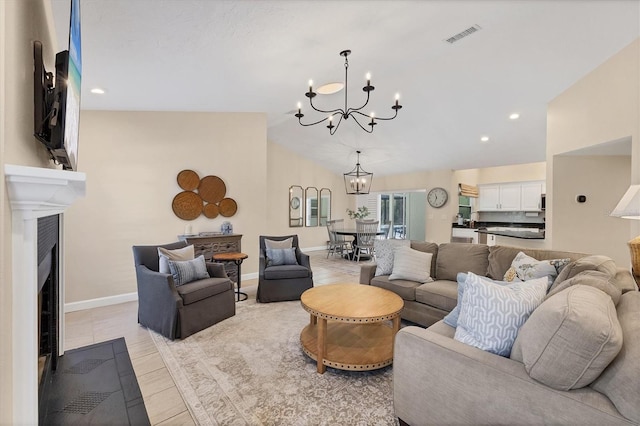 living room with lofted ceiling and a notable chandelier