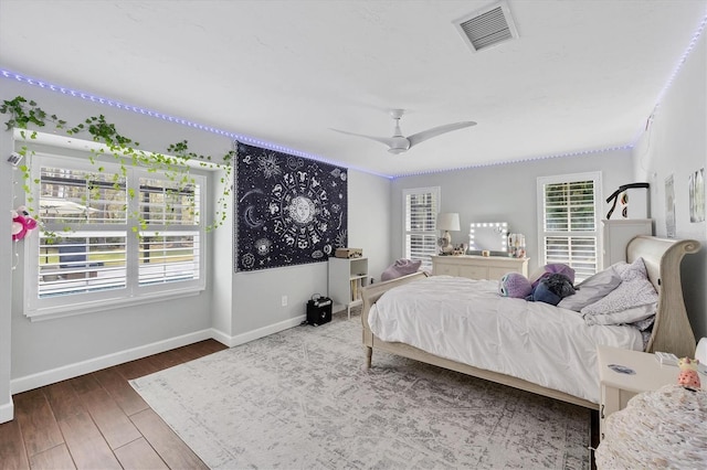 bedroom featuring wood-type flooring and ceiling fan