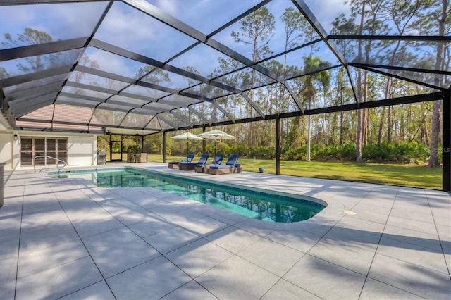 view of pool featuring a patio area and glass enclosure