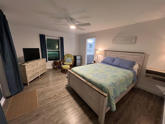 bedroom featuring ceiling fan and dark hardwood / wood-style flooring