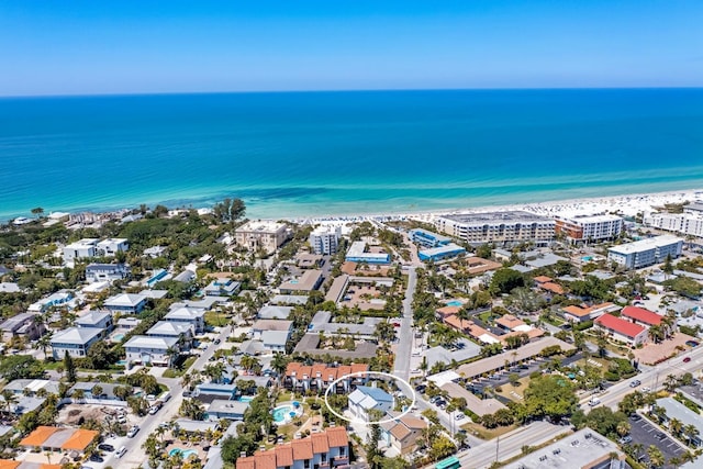 aerial view featuring a water view and a beach view