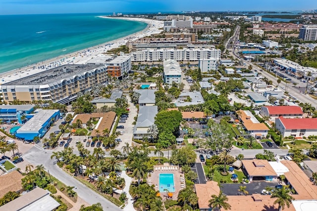 drone / aerial view featuring a water view and a beach view