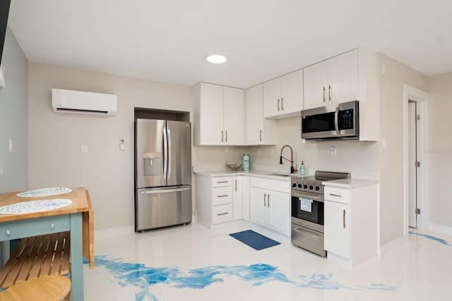 kitchen with stainless steel appliances, sink, a wall mounted AC, and white cabinets