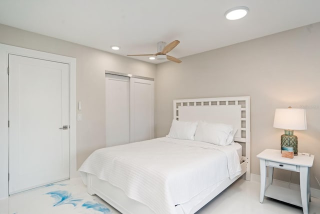 bedroom with ceiling fan and a closet